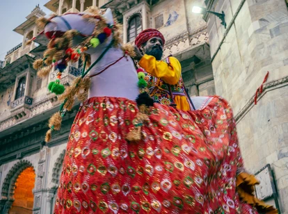 Indian man in traditional dress on a horse